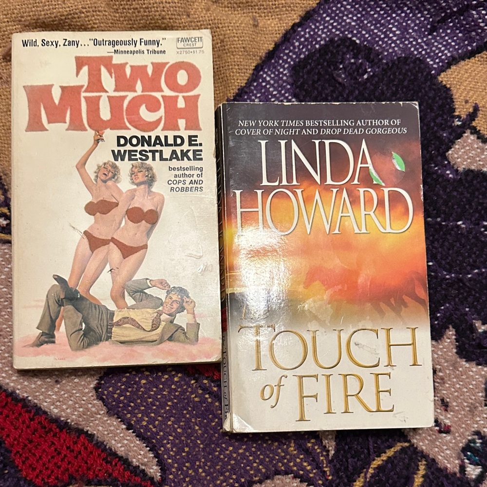 Two Paperback Books: 'Two Much' and 'Touch of Fire'